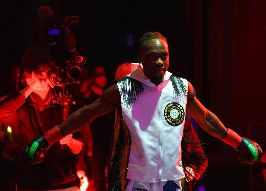 Mccainly Thomas walking to the ring under red light